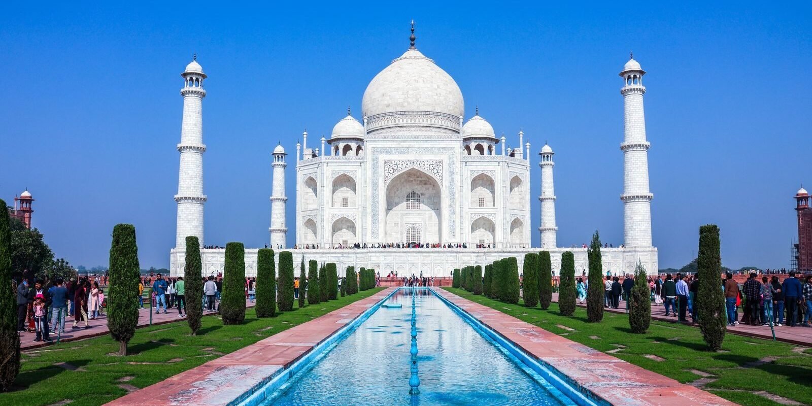 Stunning frontal view of the iconic Taj Mahal in Agra, India, with clear blue skies.